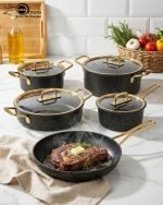 Falez 9-piece non-stick granite cookware set in black with gold handles, including fry pan, casserole, sauce pan, and pots with glass lids, made in Turkey.