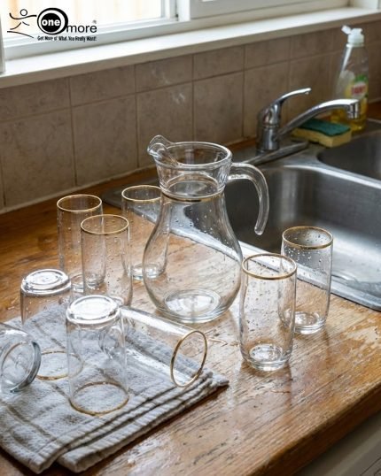 Pasabahce 7-piece clear glass water set including 1 jug and 6 glasses with elegant gold rim detailing, displaying Turkish craftsmanship – Onemore Crockery.
