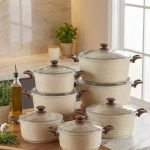 Falez beige granite non-stick casserole pot with glass lid on a kitchen counter, showcasing Made in Turkey quality and healthy low-oil cooking design.