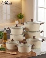 Falez beige granite non-stick casserole pot with glass lid on a kitchen counter, showcasing Made in Turkey quality and healthy low-oil cooking design.