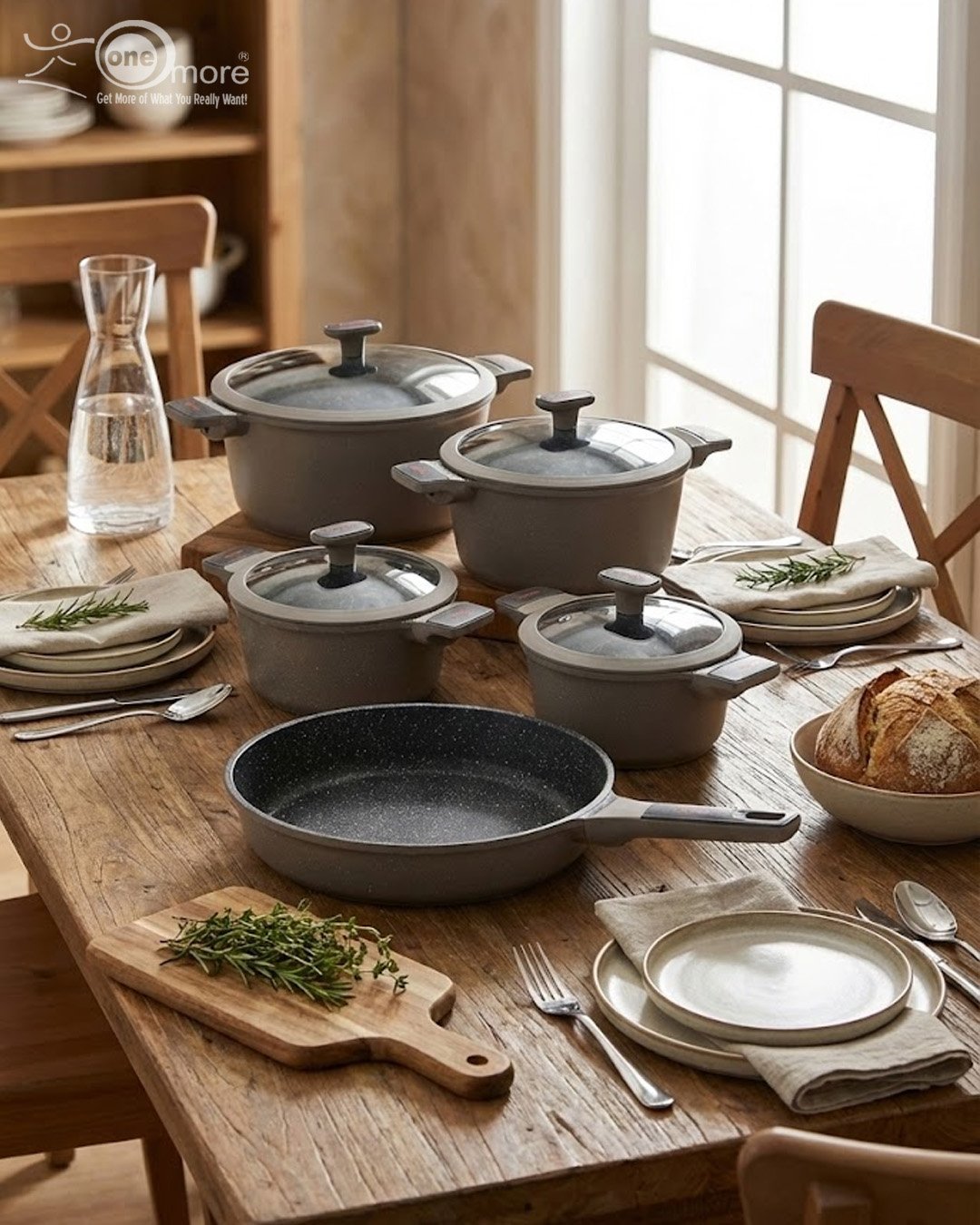 1 UCC LIFE 9-piece non-stick granite cookware set arranged on a wooden kitchen counter, featuring a frying pan, shallow casserole, and three pots with glass lids in a speckled grey finish.