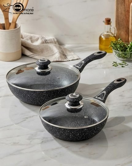 One More black granite non-stick wok pan with single long handle and glass lid, shown in 24cm and 30cm sizes, featuring a textured surface for low-oil stir frying.