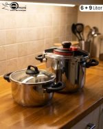 Falez stainless steel pressure cooker set including 6 liter and 9 liter pots with interchangeable pressure and glass lids, made in Turkey, displayed on a kitchen counter by One More.