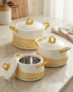 A luxury set of three insulated hotpot food warmers in matte black and white finishes featuring decorative gold hexagonal trim and polished gold handles, displayed in kitchen, dining, and outdoor settings.