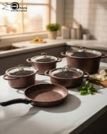 Falez 9-piece brown granite non-stick cookware set including deep pots, shallow casserole, and fry pan with glass lids, Made in Turkey, displayed on a marble kitchen counter.