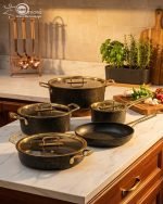 Falez 9-piece non-stick granite cookware set in black with gold handles, including fry pan, casserole, sauce pan, and pots with glass lids, made in Turkey.