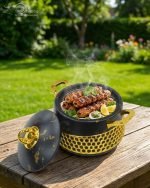 Three One More branded insulated hotpots in black and white marble finishes with gold honeycomb detailing and gold handles, shown in a kitchen and dining room setting with steaming food.
