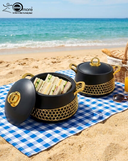 A luxury set of three insulated hotpot food warmers in matte black and white finishes featuring decorative gold hexagonal trim and polished gold handles, displayed in kitchen, dining, and outdoor settings.