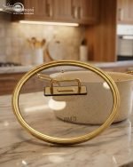 Falez 9-piece cream granite non-stick cookware set with gold handles, featuring a fry pan, sauce pan, and casseroles with glass lids, made in Turkey for healthy low-oil cooking.