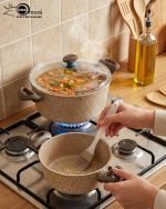 Falez beige granite non-stick casserole pot with glass lid on a kitchen counter, showcasing Made in Turkey quality and healthy low-oil cooking design.