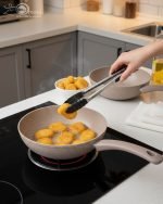 O.M.S. brown granite non-stick wok pan made in Turkey, displaying stir-fry cooking with 90% less oil and fresh ingredients on a kitchen counter.