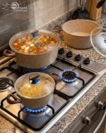 Falez beige granite non-stick casserole pot with glass lid on a kitchen counter, showcasing Made in Turkey quality and healthy low-oil cooking design.