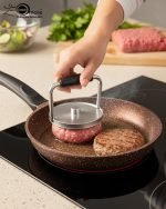 Falez 9-piece brown granite non-stick cookware set including deep pots, shallow casserole, and fry pan with glass lids, Made in Turkey, displayed on a marble kitchen counter.