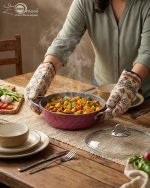 Falez 9-piece purple granite cookware set arranged on a kitchen counter, featuring non-stick deep pots, a shallow casserole with glass lids, and a frying pan with food cooking inside, Made in Turkey.