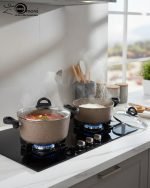 Falez 9-piece brown speckled granite non-stick cookware set displayed on a kitchen counter, featuring a fry pan, shallow casserole, and three deep pots with glass lids - Made in Turkey.