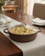 Falez 9-piece brown granite non-stick cookware set including deep pots, shallow casserole, and fry pan with glass lids, Made in Turkey, displayed on a marble kitchen counter.