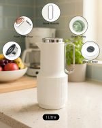 1-liter vacuum insulated thermos flask displaying three color options: green, white, and grey, standing side by side.