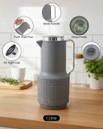 1-liter vacuum insulated thermos flask displaying three color options: green, white, and grey, standing side by side.