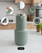 1-liter vacuum insulated thermos flask displaying three color options: green, white, and grey, standing side by side.