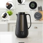 1 Litre vacuum flask thermos jug featuring a textured geometric design and gold accent strip. Shown in Off-White, Grey, and Black colors on a marble kitchen counter with callouts highlighting the glass interior, sleek handle, and air-tight cap.