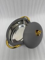 A set of three modern, oval-shaped insulated hotpots with gold handles and knobs, shown in chocolate brown, grey, and white colors on wooden and marble dining surfaces.