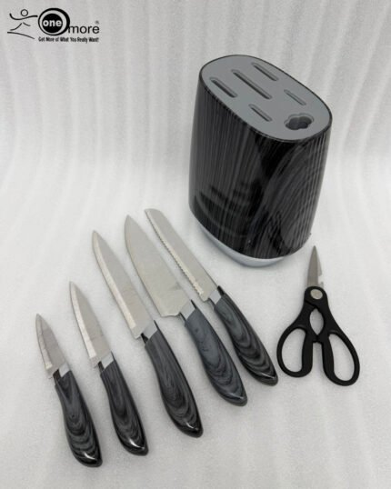 A professional 6-piece kitchen knife set featuring dark grey wood-grain patterned handles and a matching universal storage block, displayed on a white marble countertop with fresh lemons and herbs.