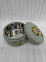 A set of three round, quilted insulated hotpots in varying sizes (1L, 2.5L, and 4L) with gold handles and lid accents, displayed on a kitchen counter and wooden dining table.