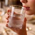 Set of six RCR-inspired crystal whiskey glasses with a decorative swirl texture and a luxury hand-painted golden rim.