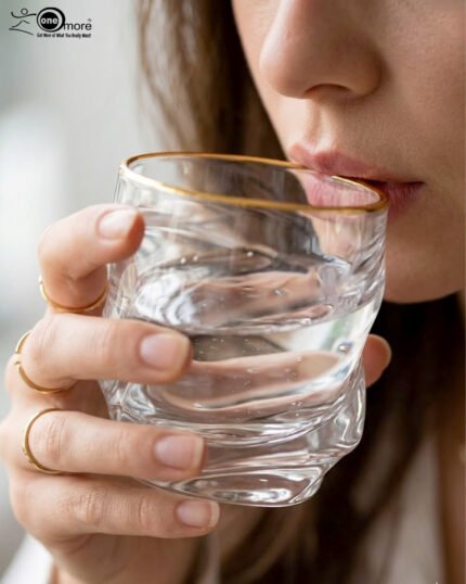 A set of six clear crystal drinking glasses featuring a unique twisted, rippled texture and a thin decorative gold rim on a neutral background.