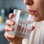 A set of 6 RCR-inspired crystal whiskey glasses featuring vertical cut ridges, a diamond-patterned base, and a luxury gold-plated rim on a white background.