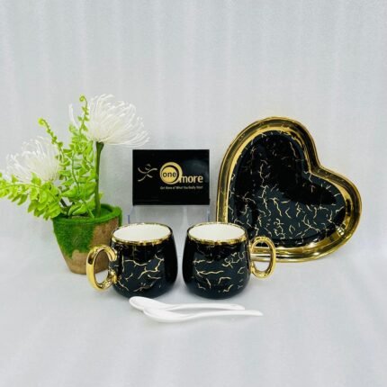A luxury 5-piece stoneware coffee set for couples featuring two round marble-patterned mugs with gold handles, two white spoons, and a matching heart-shaped gold-rimmed tray, available in black, white, green, blue, and yellow.