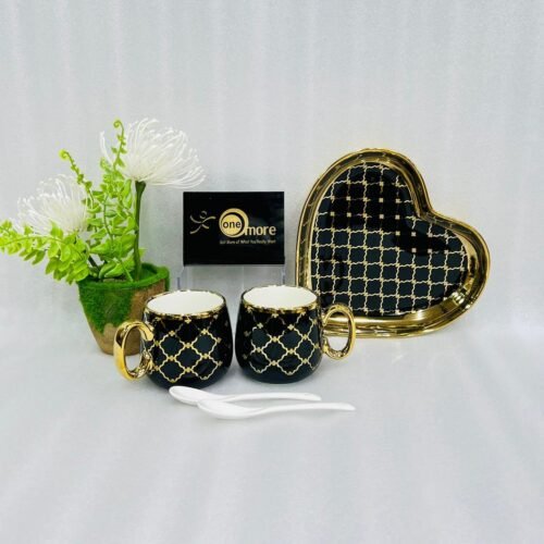 A luxury 5-piece stoneware coffee set for couples featuring two mugs with gold lattice patterns, a matching heart-shaped tray with gold trim, and two white spoons, available in multiple colors including black, green, and pink.