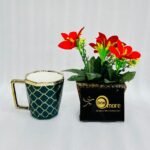 Modern ceramic coffee mug with gold handle and geometric trellis pattern, available in black, green, red, white, and yellow.