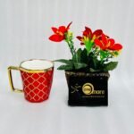 Modern ceramic coffee mug with gold handle and geometric trellis pattern, available in black, green, red, white, and yellow.
