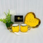 A luxury 5-piece stoneware coffee set for couples featuring two round marble-patterned mugs with gold handles, two white spoons, and a matching heart-shaped gold-rimmed tray, available in black, white, green, blue, and yellow.
