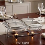 A luxurious Paramount Series 5-in-1 food warmer set on a wooden dining table, featuring four 2.5L glass serving dishes with polished stainless steel lids and tealight buffet burners underneath.
