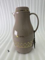 A trio of elegant 2-liter Feenik thermal flasks in cream, grey, and taupe featuring gold floral patterns on a marble kitchen countertop.