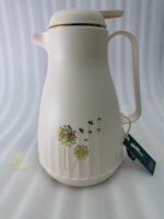 Two 1-liter insulated thermal flasks in Earth Grey and Creamy Beige, featuring golden dandelion designs and ergonomic handles, displayed on a kitchen countertop.