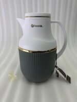 Three 1-liter Feenik thermal flasks in charcoal, taupe, and gray colors with gold trim on a marble kitchen countertop.