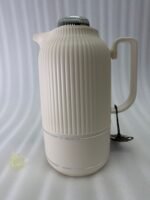 A collection of three 1-liter Feenik thermal flasks featuring a vertical ribbed design in beige, gray, and taupe on a white marble countertop.