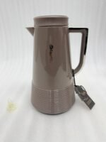 A trio of Feenik 1-liter thermal vacuum flasks in cream, sand grey, and mocha colors, displayed on a marble kitchen countertop.