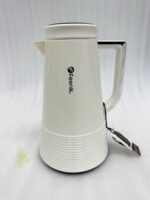 A trio of Feenik 1-liter thermal vacuum flasks in cream, sand grey, and mocha colors, displayed on a marble kitchen countertop.