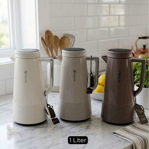 A trio of Feenik 1-liter thermal vacuum flasks in cream, sand grey, and mocha colors, displayed on a marble kitchen countertop.