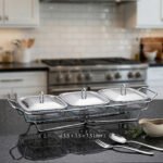 A Paramount Series 3-in-1 buffet food warmer featuring three square glass serving dishes with stainless steel lids on a chrome wire rack, displayed on a kitchen counter and an outdoor dining table with tea light candles lit underneath.