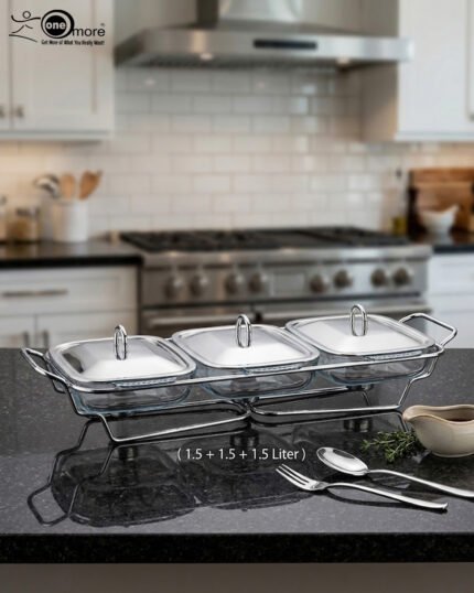 A Paramount Series 3-in-1 buffet food warmer featuring three square glass serving dishes with stainless steel lids on a chrome wire rack, displayed on a kitchen counter and an outdoor dining table with tea light candles lit underneath.