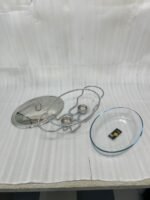 Three Paramount Series glass and stainless steel food warmers in 1.5L, 2L, and 3L sizes arranged on a dining table with tea light candles lit underneath.