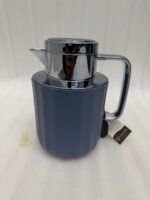 Three 1-liter Nordic-style thermal flasks in Slate Blue, Sand Beige, and Soft Rose colors with fluted textures and metallic lids displayed on a kitchen counter.