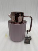 Three 1-liter Nordic-style thermal flasks in Slate Blue, Sand Beige, and Soft Rose colors with fluted textures and metallic lids displayed on a kitchen counter.