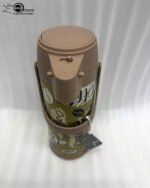 A 1.9-liter olive green Day Days vacuum insulated coffee airpot with a brown pump-action lid and handle, featuring a decorative coffee bean pattern, displayed on a kitchen counter next to a coffee cup.