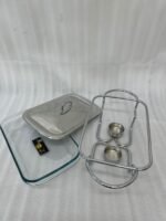 Three elegant Paramount Series food warmers in different sizes (1.5L, 2.4L, and 3L) featuring stainless steel lids and glass dishes with candle-lit buffet burners on a dining table.